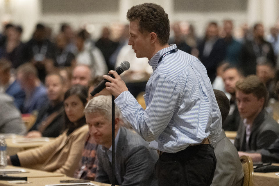 New York Mets pro player personnel assistant Bryan Woolley announces the team's selection in the Rule 5 Draft during the Major League Baseball winter meetings Wednesday, Dec. 6, 2023, in Nashville, Tenn. (AP Photo/George Walker IV)