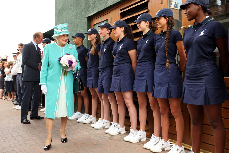 <p>On day four of the 2010 tournament, Her Majesty met Wimbledon’s ball boys and girls at the All England Lawn Tennis and Croquet Club on 24 June. It was her first visit to the tournament in 33 years. <em>[Photo: Getty]</em> </p>