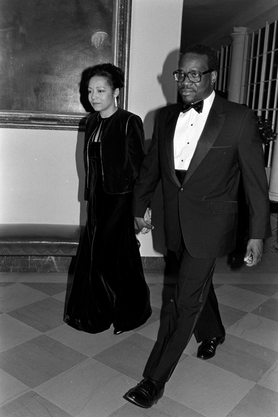 Kathy Ambush and Clarence Thomas attend an event at the White House in Washington, D.C., on March 19, 1985.
