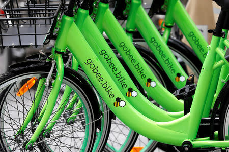 FILE PHOTO: Several "Gobee.bike" bicycles, a city bike-sharing service, by Hong Kong startup Gobee.bike, are seen on a sidewalk in Paris, France, October 10, 2017. REUTERS/Charles Platiau/File Photo