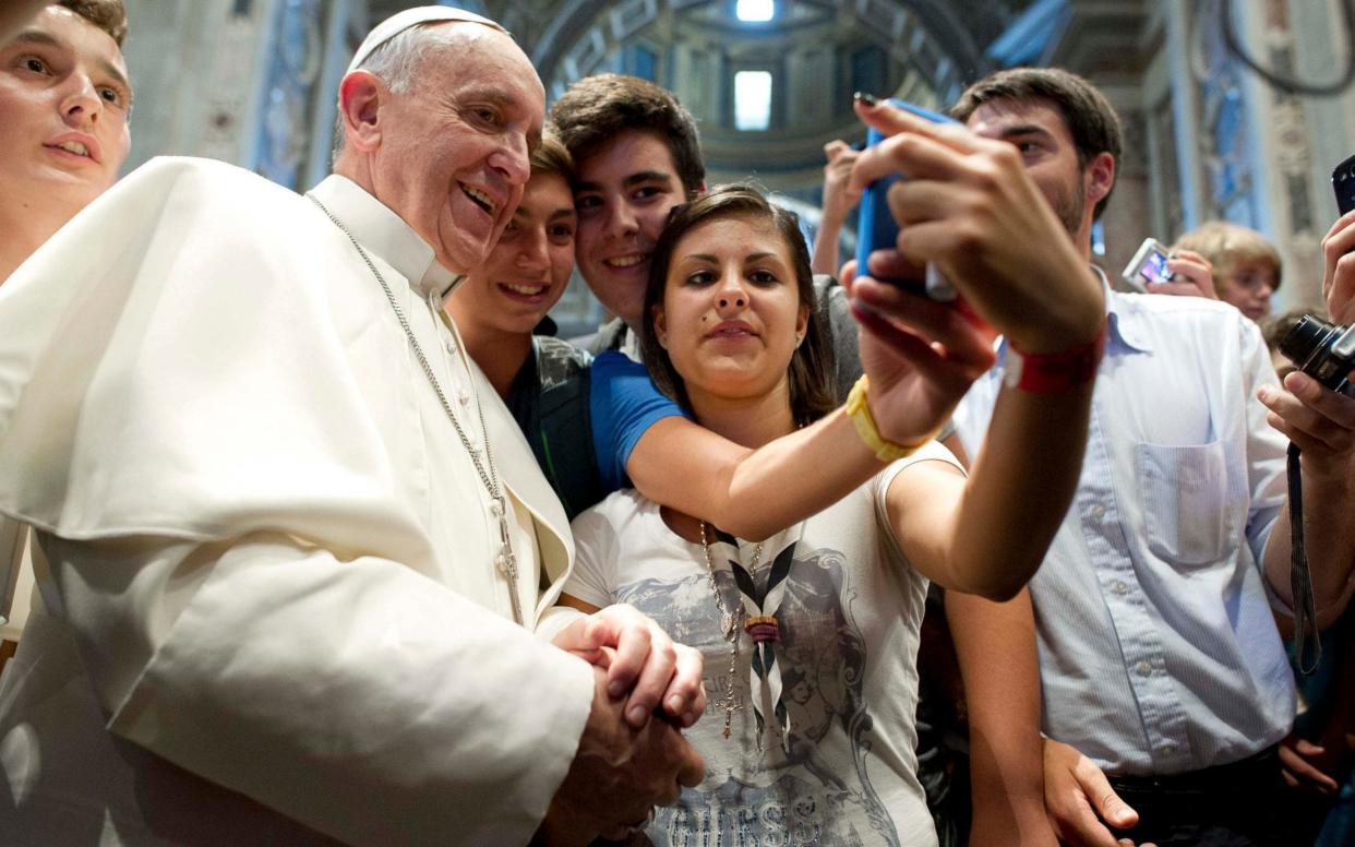 The pope has never been seen with his own smartphone in public  - Reuters