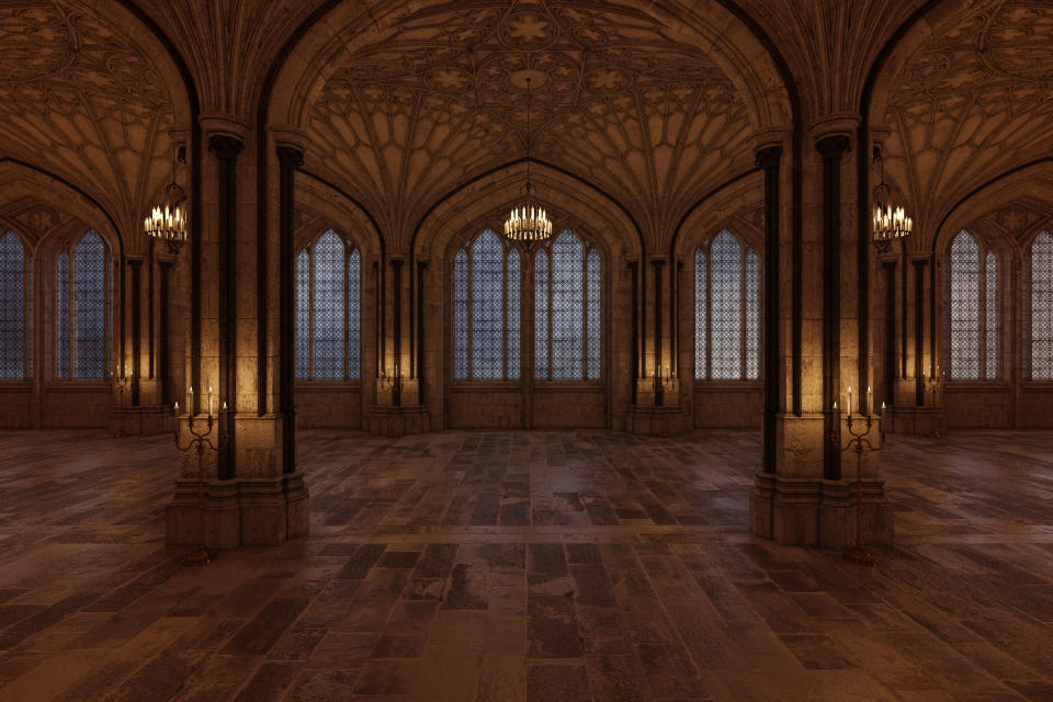 Gothic-style hall with ornate vaulted ceilings and multiple arched windows