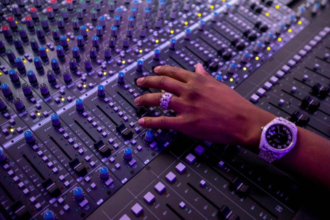 Producer ATL Jacob manipulates a mixing board at a recording studio in Miami, Florida, on Wednesday, Sept. 7, 2022.