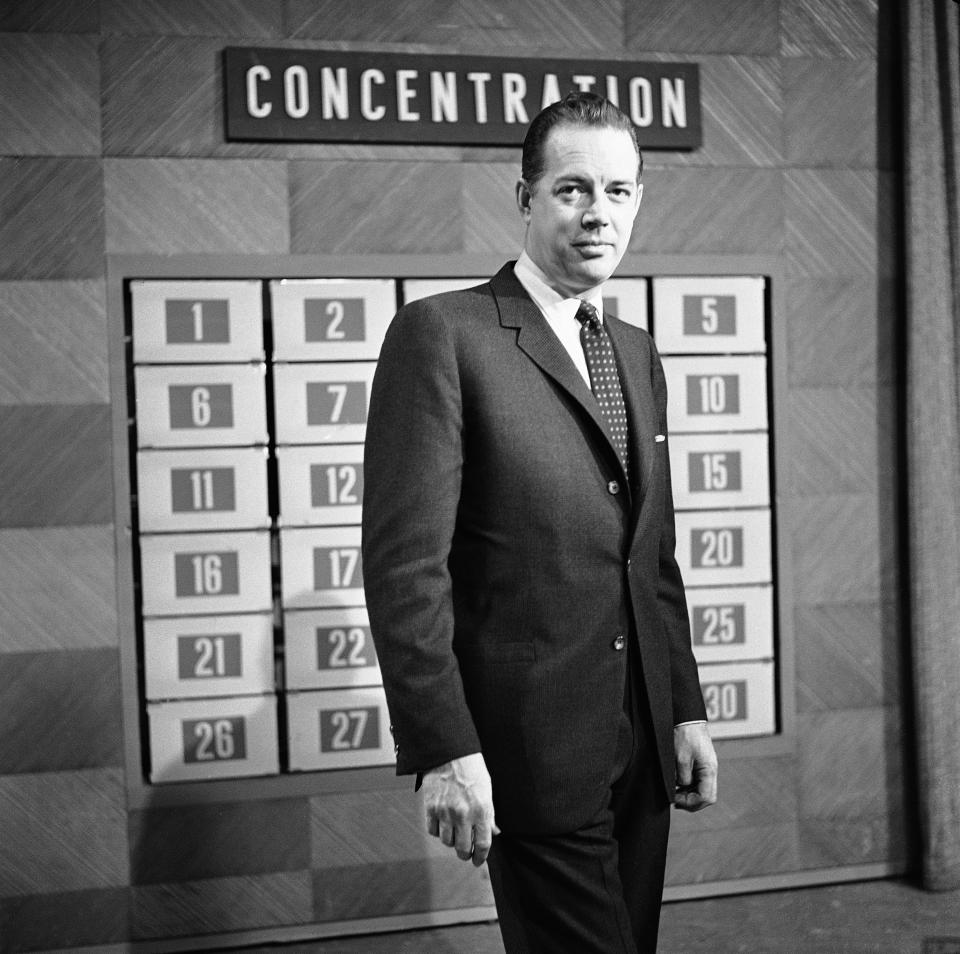 FILE - This Feb. 15, 1960 file photo shows host Hugh Downs on the set of the game show "Concentration" in National Broadcasting Company Studio in New York. Downs, a genial and near-constant presence on television from the 1950s through the 1990s, has died. His family said Downs died of natural causes Wednesday, July 1, 2020, in Scottsdale, Ariz. He was 99. Downs was a host of the ‘Today’ show on NBC, worked on the ‘Tonight’ show when Jack Paar was in charge, and hosted the long-running game show "Concentration." (AP Photo, File)