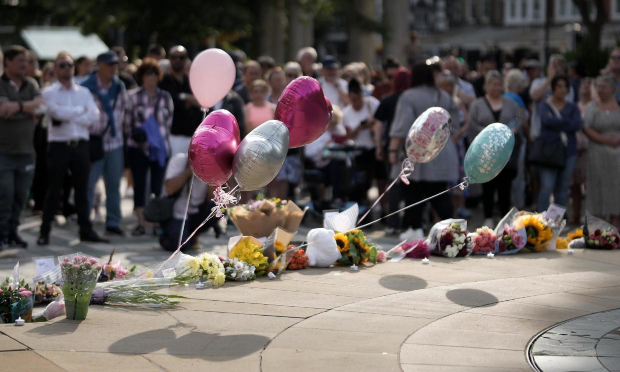 <span>People attend a vigil on Tuesday for the victims of the knife attack in Southport.</span><span>Photograph: Christopher Furlong/Getty Images</span>