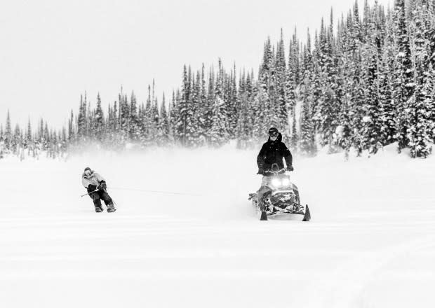 When you reach the lake, that’s usually the end of the run, but with the right transportation and a keen eye for terrain, Banks Gilberti keeps it going with a tow from Rory Bushfield. Tough to tell if more fun was had on the tow in or the jump. Location: Pemberton, British Columbia<p>Photo: Tal Roberts</p>