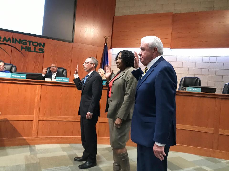 Bill Dwyer, at right, is sworn into the Farmington Hills City Council on Nov. 27, 2023. Dwyer, the city's former police chief, was the top vote-getter in last month's city election, capping a career of nearly 62 years in public service.