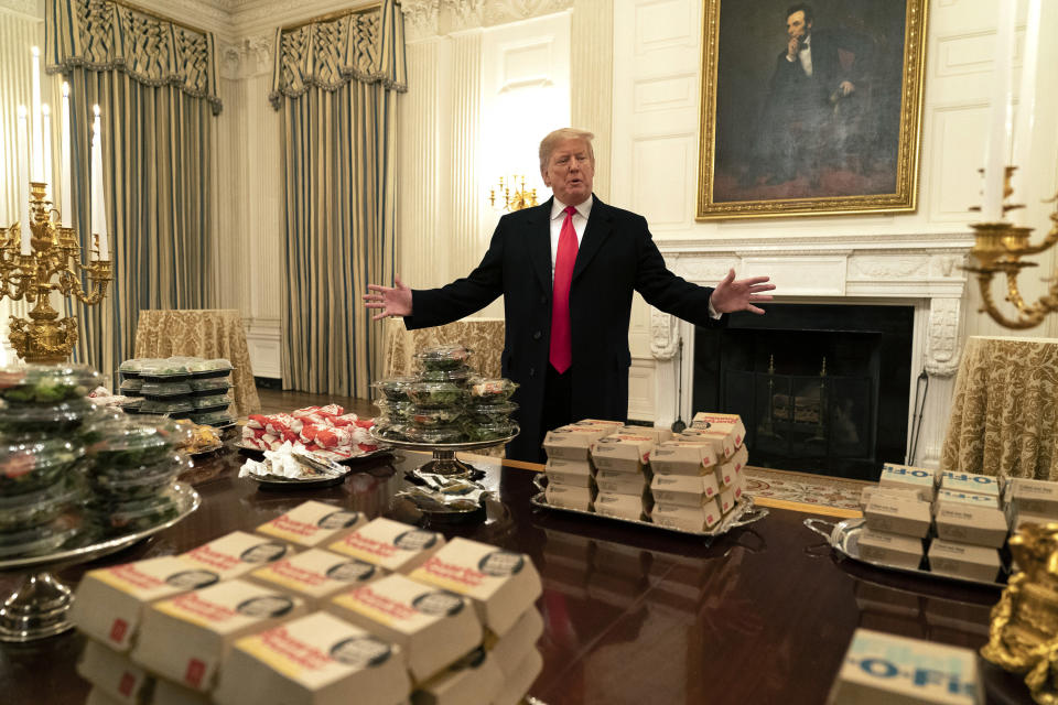 WASHINGTON, DC - JANUARY 14: (AFP OUT) U.S President Donald Trump presents fast food to be served to the Clemson Tigers football team to celebrate their Championship at the White House on January 14, 2019 in Washington, DC. (Photo by Chris Kleponis-Pool/Getty Images)