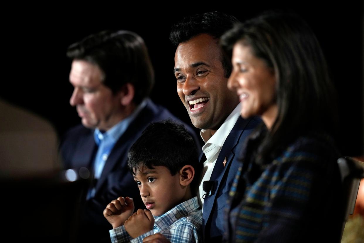 Republican presidential candidate businessman Vivek Ramaswamy holds his three-year old son Karthik as he speaks during the Family Leader's Thanksgiving Family Forum, Friday, Nov. 17, 2023, in Des Moines, Iowa. (AP Photo/Charlie Neibergall)
