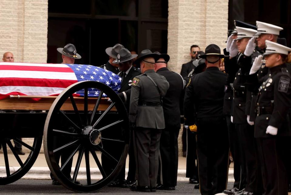 A casket of Investigator Sam Poloche of the N.C. Department of Adult Correction makes its way to First Baptist Church in Charlotte for the memorial service on Monday, May 13, 2024. Poloche killed in the line of duty while serving a warrant in east Charlotte on Monday April 29, 2024.

