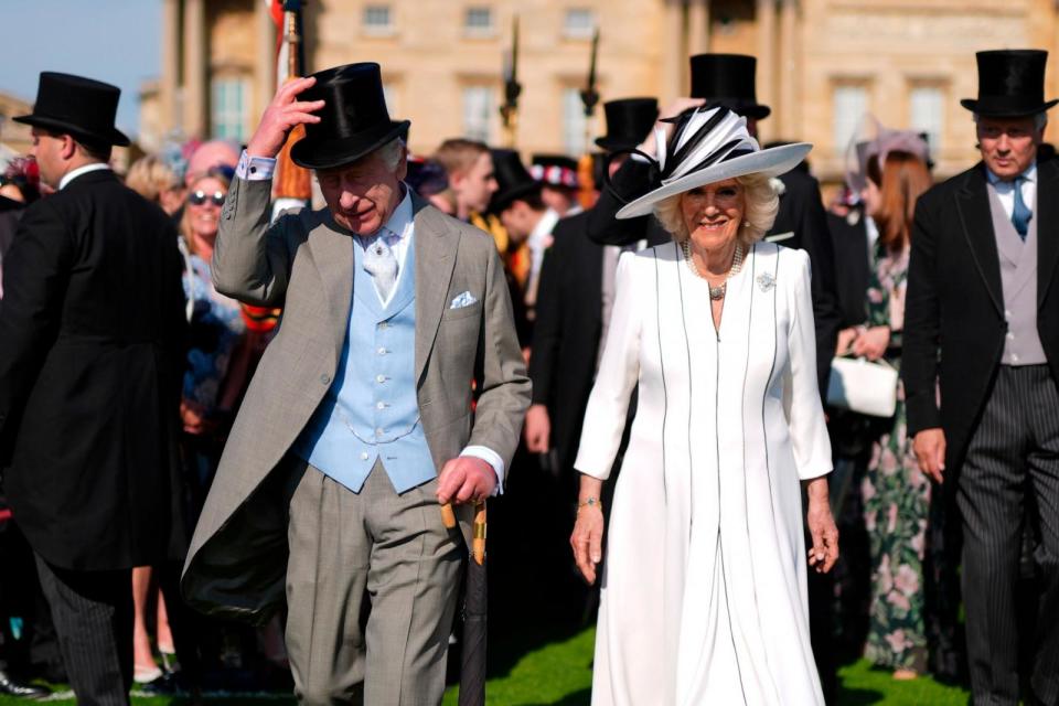 PHOTO: Britain's King Charles III, left, and Queen Camilla attend a Royal Garden Party at Buckingham Palace, May 8, 2024, in London.  (Jordan Pettitt/AP)