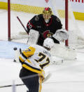 Pittsburgh Penguins center Jeff Carter fires the puck wide of the net past Ottawa Senators goaltender Joonas Korpisalo during the third period of an NHL hockey game, Tuesday, March 12, 2024, Ottawa, Ontario. (Adrian Wyld/The Canadian Press via AP)