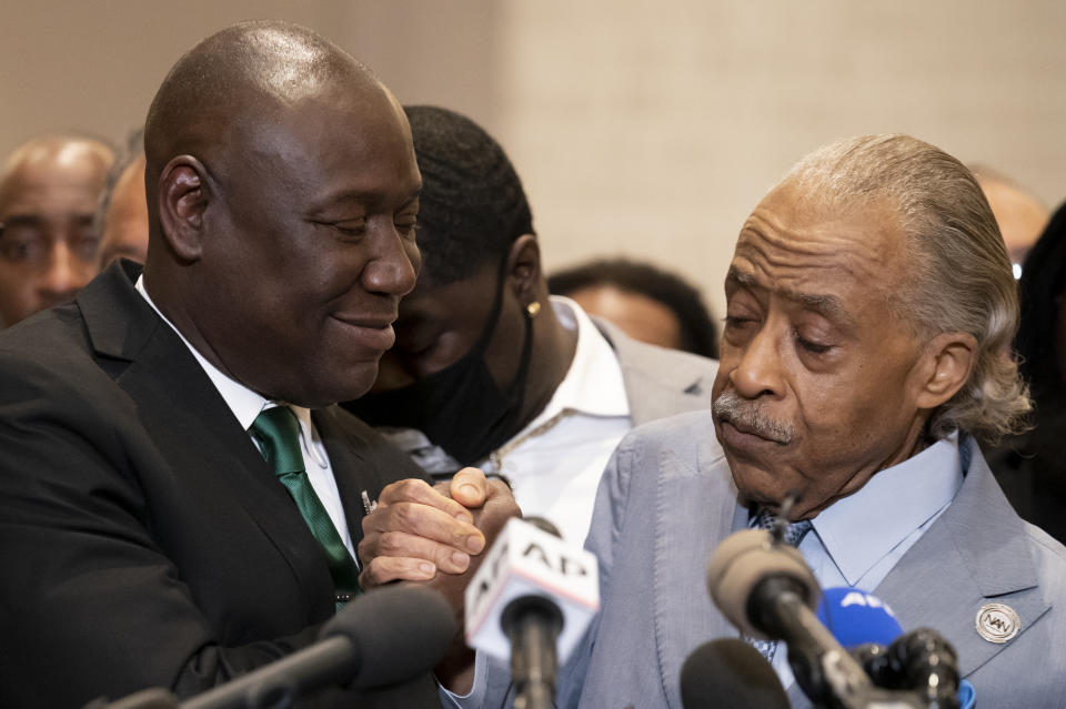 FILE - In this April 20, 2021 file photo, Attorney Ben Crump, left, and Rev. Al Sharpton shake hands during a news conference after former Minneapolis police Officer Derek Chauvin is convicted in the killing of George Floyd, in Minneapolis. Sharpton and an attorney for George Floyd's family are speaking at the memorial Tuesday, July 6, 2021, for a white Arkansas teenager shot dead by a deputy, a case that civil rights activists say highlights the need for interracial support to address police shootings. (AP Photo/John Minchillo File)