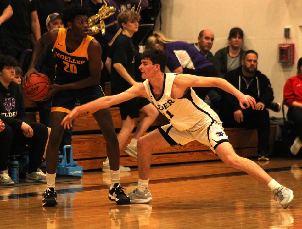 Eric Mahaffey (with ball) is a starter for this year's Moeller team.