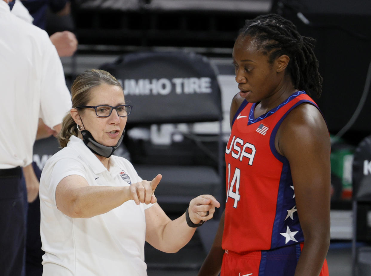 LAS VEGAS, NEVADA - JULY 16:  Assistant coach Cheryl Reeve of the United States talks with Tina Charles #14 during an exhibition game against the Australia Opals at Michelob ULTRA Arena ahead of the Tokyo Olympic Games on July 16, 2021 in Las Vegas, Nevada. Australia defeated the United States 70-67.  (Photo by Ethan Miller/Getty Images)