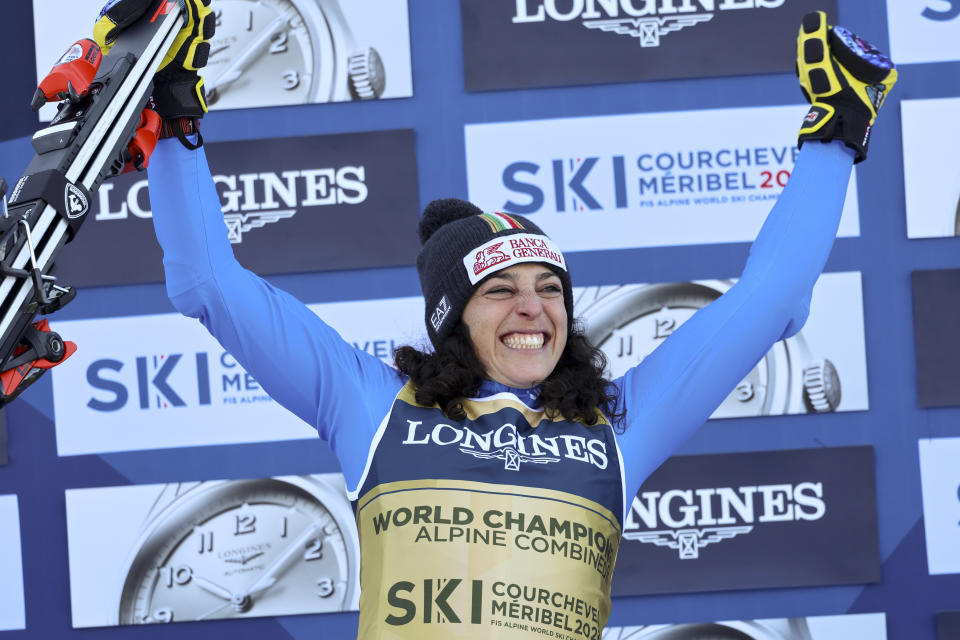 Italy's Federica Brignone, winner of an alpine ski, women's World Championship combined race, celebrates on the podium, in Meribel, France, Monday, Feb. 6, 2023. (AP Photo/Marco Trovati)