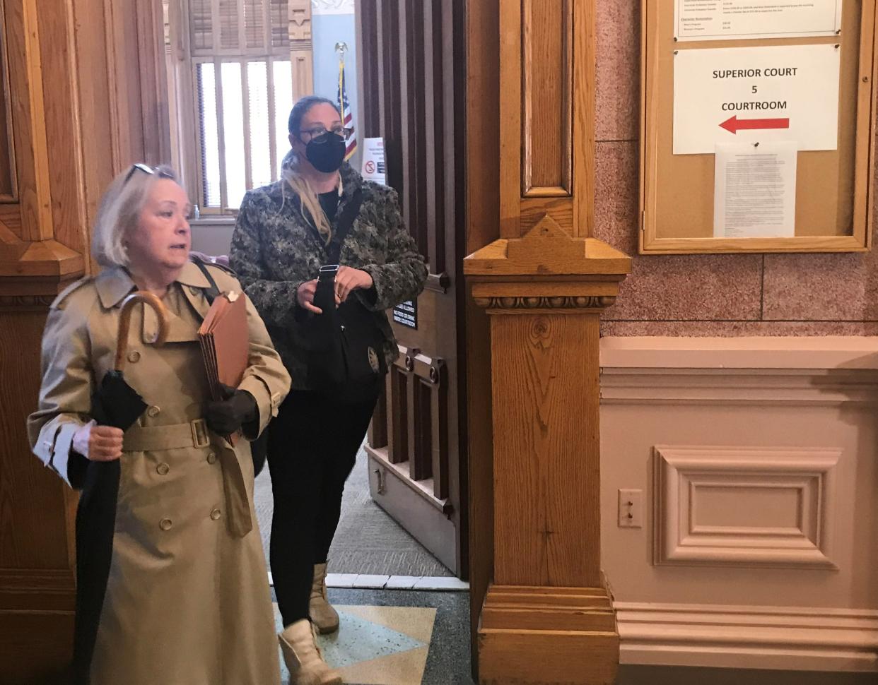 Jennifer Teising, on the right, leaves Tippecanoe Superior 5 on March 7, 2022, after being sentenced to three years of court supervision, including 124 days in jail. Teising moved out of the township where she was trustee, then continued to collect her paycheck. She was convicted Jan. 5, 2022, of 21 counts of theft.