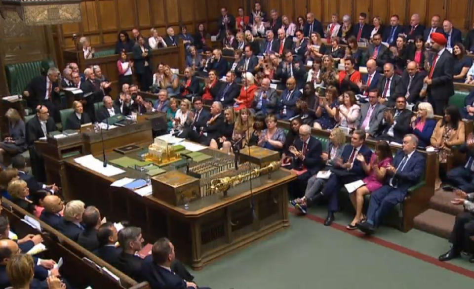 Labour MPs clapping the remarks of Tanmanjeet Singh Dhesi, Labour MP, for Slough) as he calls on Prime Minister Boris Johnson to apologise for his derogatory comments after he likened Muslim women who wear a veil to bank robbers and letter boxes, during Prime Minister's Questions in the House of Commons, London.