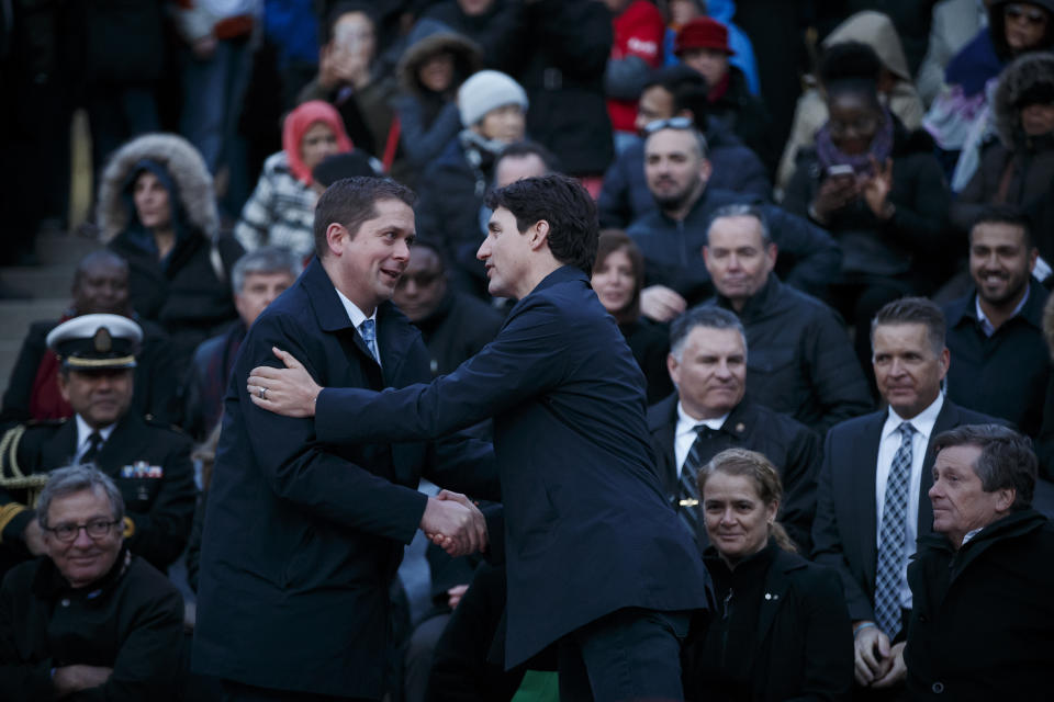 TORONTO, ON - Prime Minister Justin Trudeau, right, shakes hands with the leader of the Conservative Party of Canada, Andrew Scheer. (Photo by Cole Burston/Getty Images)