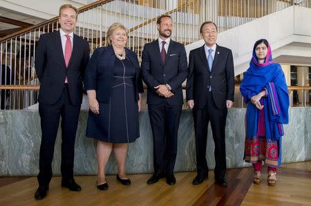 Norway's Foreign Minister Borge Brende (L-R), Prime Minister Erna Solberg, Norway's Crown Prince Haakon, U.N. Secretary-General Ban Ki-moon and Nobel Peace Prize laureate Malala Yousafzai pose for a photo during the Oslo Summit on Education for Development at Oslo Plaza, Norway July, 7, 2015. REUTERS/Vegard Wivestad Grott/NTB Scanpix