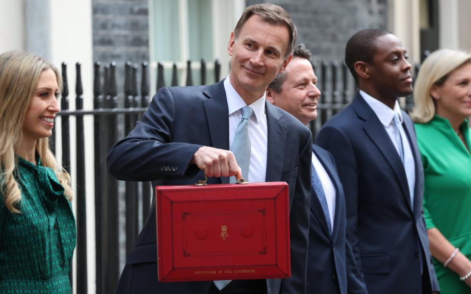 Jeremy Hunt, the Chancellor, poses with his Treasury ministerial team outside No 11 Downing Street