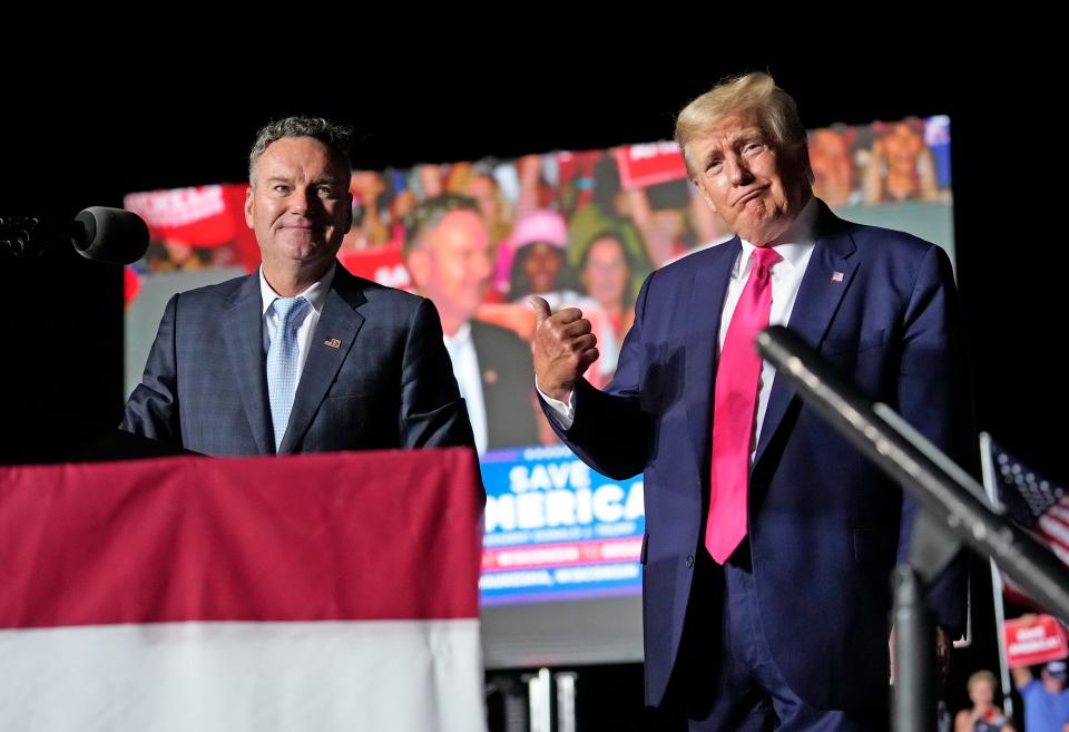 Republican candidate for governor Tim Michels, left, appears with former President Donald Trump during a campaign rally for Michels at the Waukesha County Fairgrounds in Waukesha on Friday, Aug. 5, 2022.