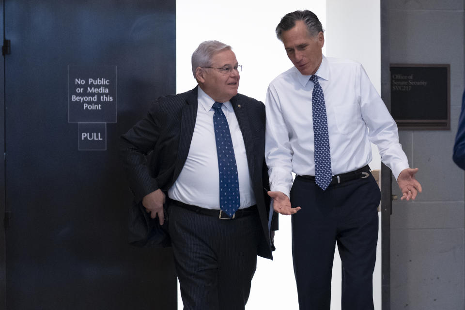 Senate Foreign Relations Chairman Robert Menendez, D-N.J., left, and Sen. Mitt Romney, R-Utah, depart after a closed briefing on the unknown aerial objects the U.S. military shot down this weekend at the Capitol in Washington, Feb. 14, 2023. After four years in Washington, Romney has established himself as a rare senator willing to publicly rebuke members of his own party. But the Utah senator’s outspoken stances, along with his willingness to work with Democrats, have angered some Republicans in the deep-red state he represents and led them to cast about for someone to try to dethrone him a primary race next year. (AP Photo/J. Scott Applewhite, File)