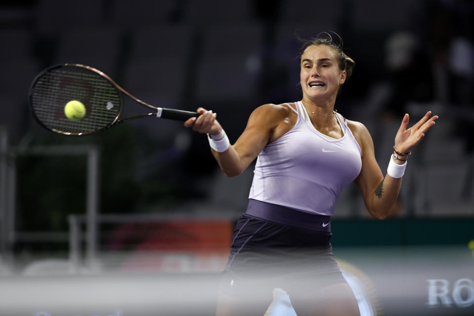 Aryna Sabalenka of Belarus returns a volley from Maria Sakkari of Greece in the second set of their match during round-robin play on day three of the WTA Finals tennis tournament in Fort Worth, Texas, Wednesday, Nov. 2, 2022. Sakkari won 6-2, 6-4. (AP Photo/Tim Heitman)