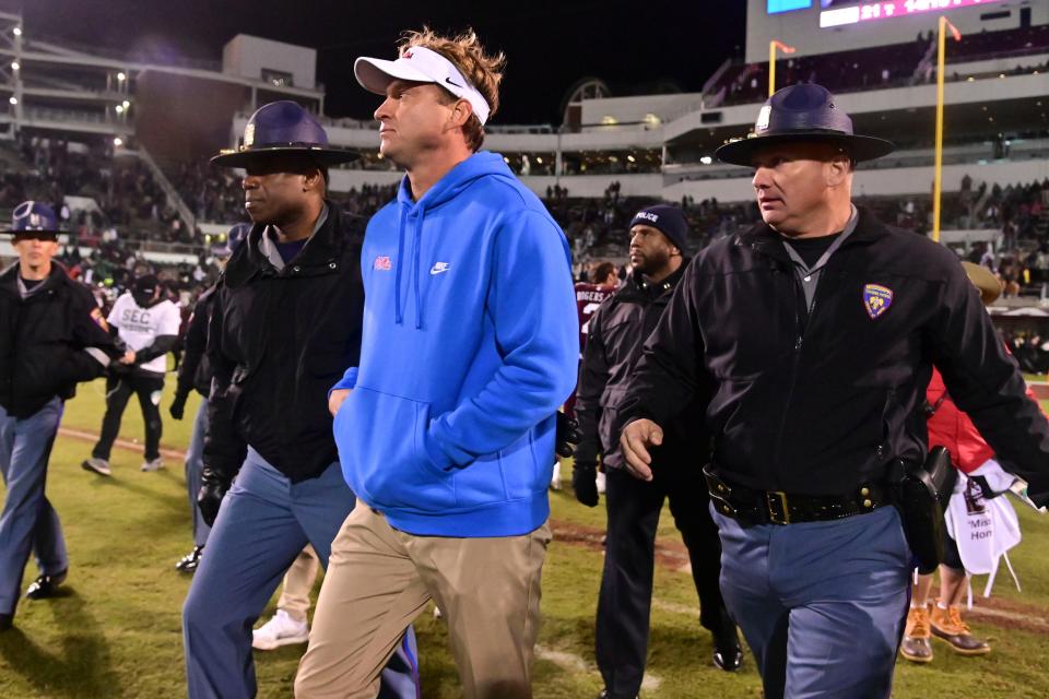 Mississippi head coach Lane Kiffin walks off the field after a 31-21 victory against Mississippi State in the Egg Bowl.