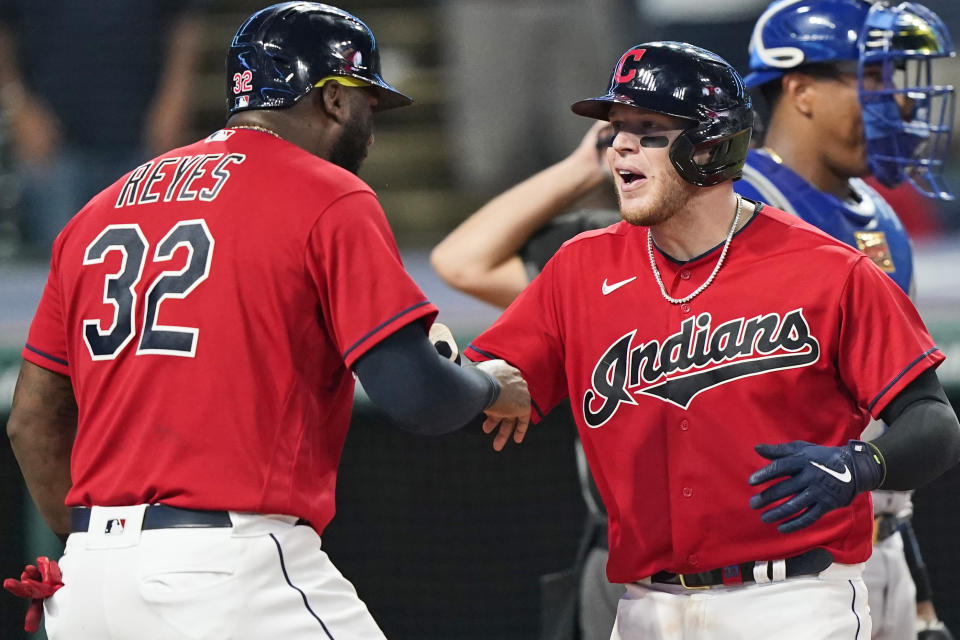 Cleveland Indians' Roberto Perez, right, and Franmil Reyes celebrate after Perez hit a three run home run in the eighth inning of a baseball game against the Kansas City Royals, Thursday, July 8, 2021, in Cleveland. (AP Photo/Tony Dejak)