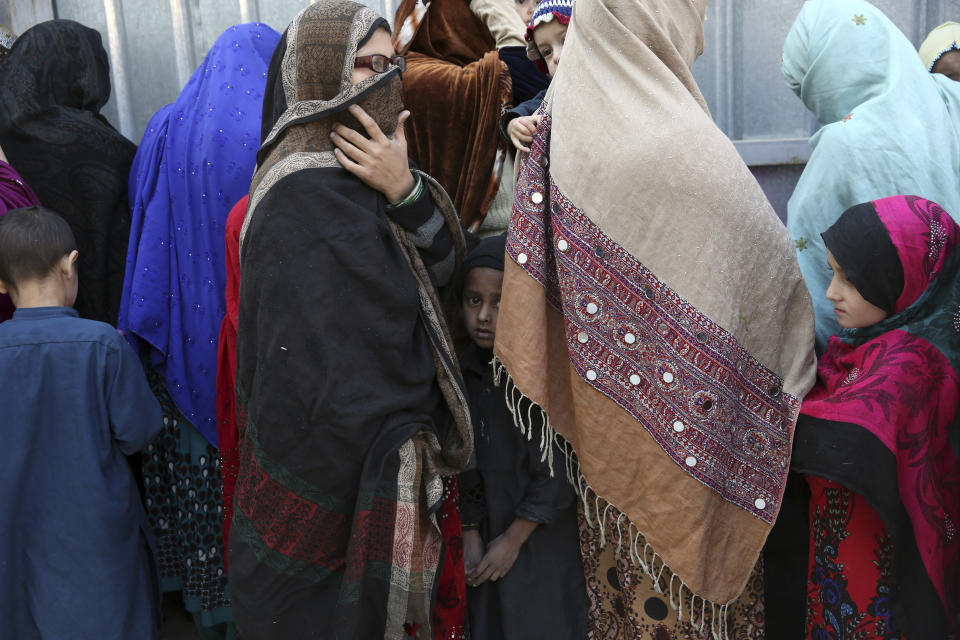 Family members of Islamic State militants either arrested or surrounded up to the Afghan government are presented to media in Kabul, Afghanistan, Saturday, Dec. 21, 2019. The country's intelligence service says Saturday that there are more than 75 women and 159 children most of them form foreign countries in the custody of the agency known as the National Deteriorate for Security. (AP Photo/Rahmat Gul)