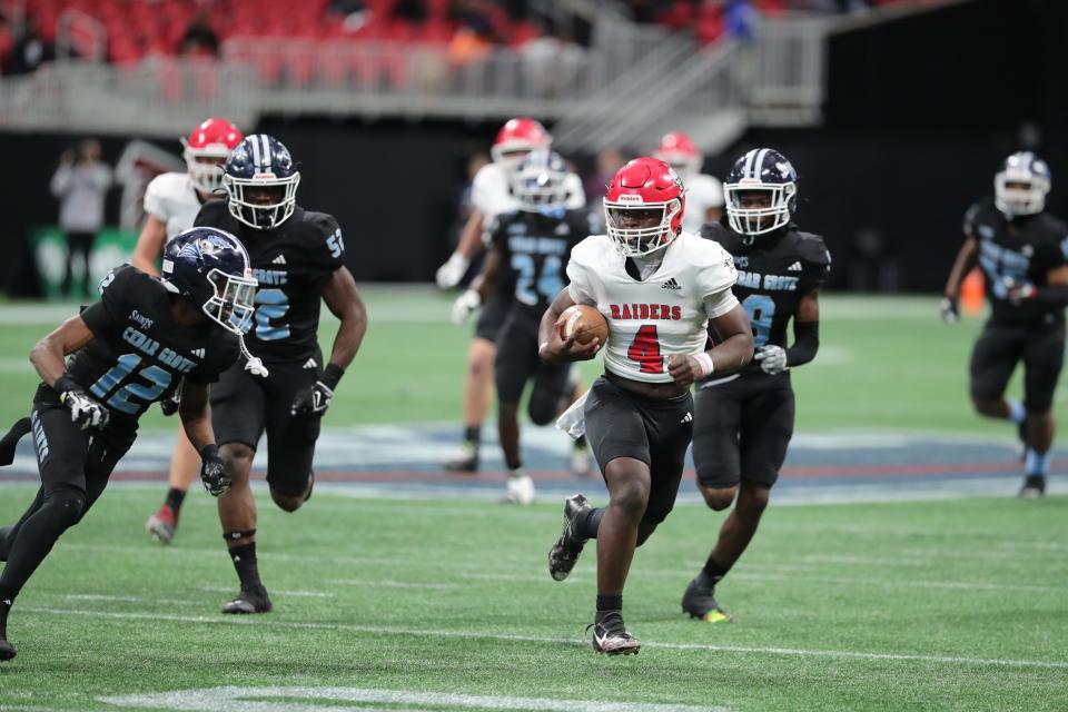 Savannah Christian's Zo Smalls finds some open field against the Cedar Grove defense during the GHSA Class 3A State Championship game on Wednesday, December 13, 2023 at Mercedes-Benz Stadium in Atlanta, Georgia.