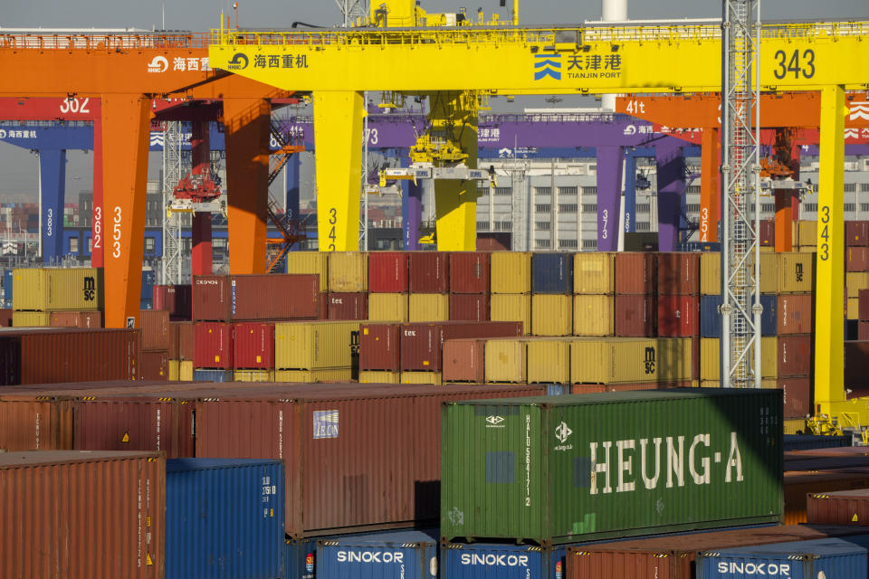 Shipping containers are stacked at a port in Tianjin, China, Monday, Jan. 16, 2023. China's exports tumbled 12.4% in June from a year earlier as demand weakened after central banks raised interest rates to curb inflation. (AP Photo/Mark Schiefelbein)