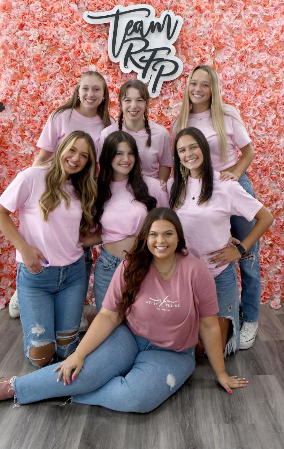 Rylie Fuline, bottom center, is owner and CEO of Rylie Fuline Photography in Canton. She graduated from college before graduating from Jackson High School.