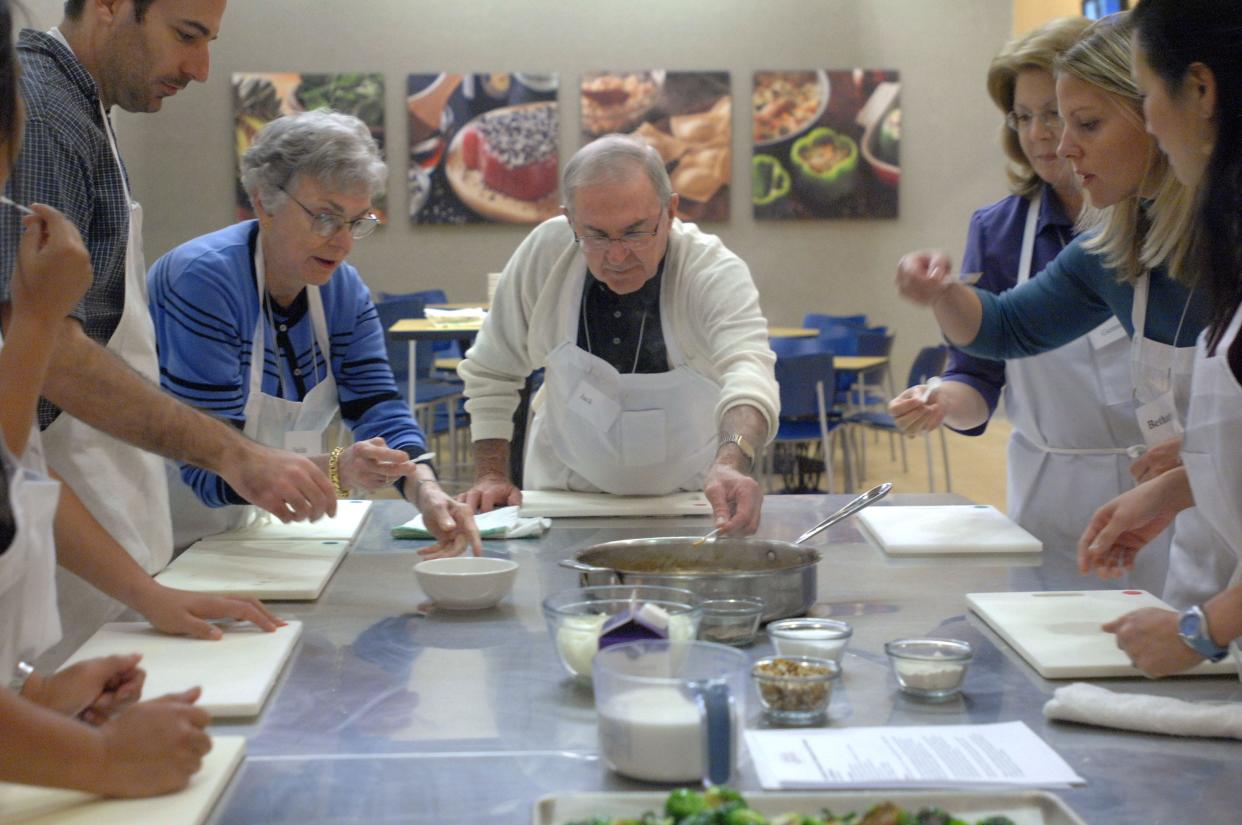 Daniel Burstein, from left, Nelda Young, Jack Botterbusch, Gennell Peterson, Bethany Prior and Avis Boulter sample the Gingerbread Gravy they made, at Aprons Cooking School at Publix on Nov. 8, 2007, as part of a Thanksgiving dinner cooking class.