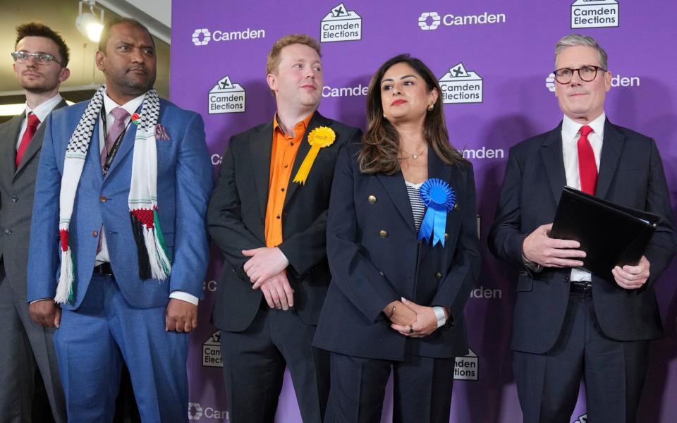 Britain's new Prime Minister Sir Keir Starmer, pictured on stage with other candidates as they awaited the result of his Holborn and St Pancras constituency