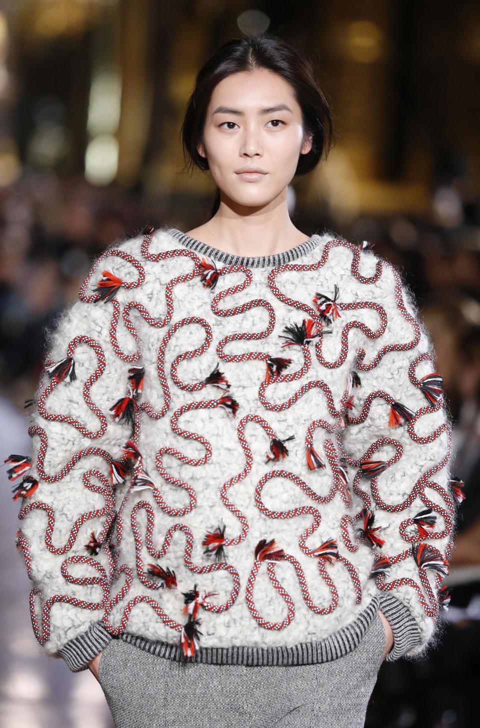 A model wears a creation for Stella McCartney's ready-to-wear fall/winter 2014-2015 fashion collection presented in Paris, Monday, March 3, 2014. (AP Photo/Jacques Brinon)