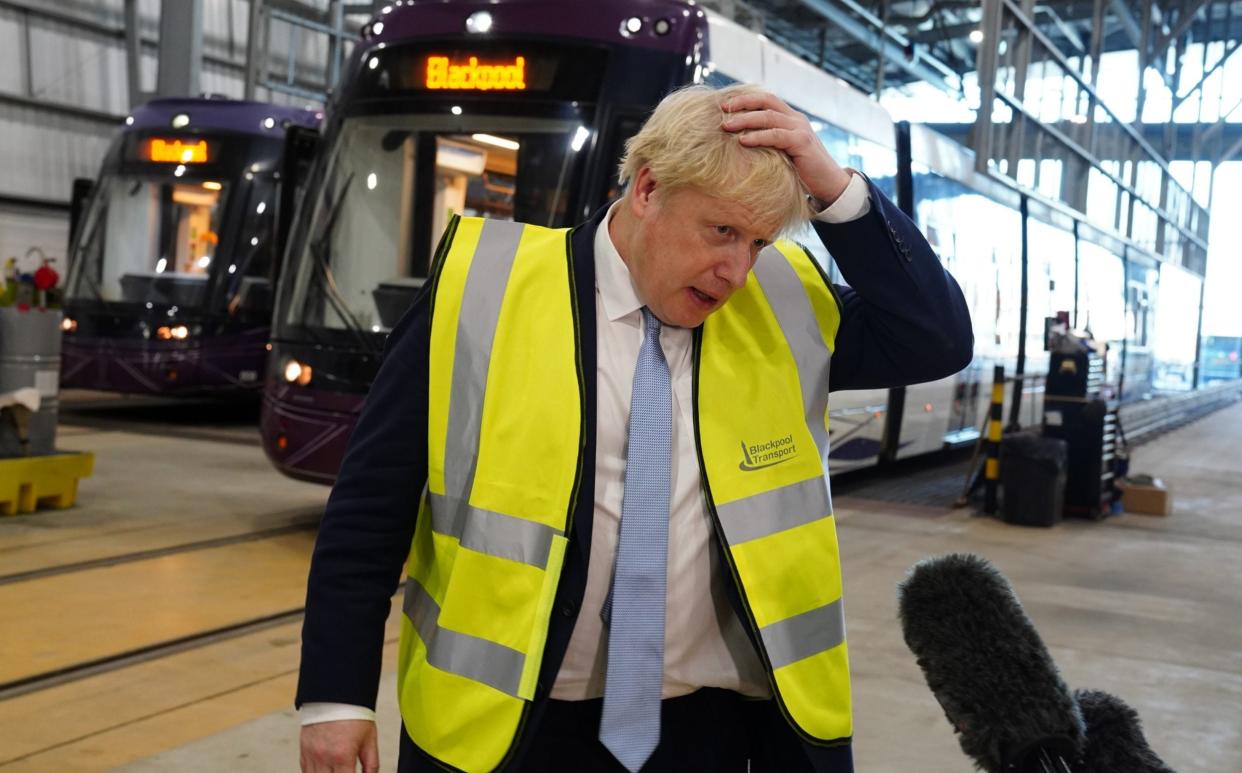 Prime Minister Boris Johnson speaks to the media during a visit to Blackpool Transport Depot