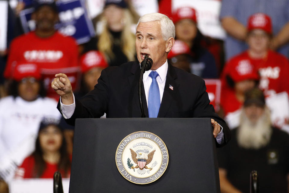 FILE - In this Feb. 21, 2020, file photo, Vice President Mike Pence speaks during a campaign rally before President Donald Trump arrives in Las Vegas. Vice President Mike Pence has a favorite line when he introduces President Donald Trump at rallies. He says "it's been three years of promises made and promises kept” under Trump. Is it true? The Associated Press reviewed what's happened with Trump's key campaign promises. (AP Photo/Patrick Semansky, File)