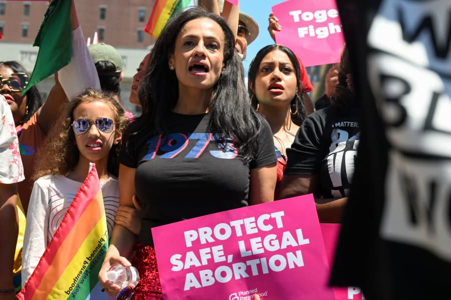 NEW YORK, NEW YORK – JUNE 26: President and CEO of Planned Parenthood Alexis McGill Johnson (C) marches with Planned parenthood at the New York City Pride Parade on June 26, 2022 in New York City. Planned Parenthood was the first contingent of the parade this year following the Supreme Court overturning the 50-year-old landmark Roe v. Wade case ending the protection of federal abortions. The annual NYC Pride Parade returned fully in person this year after being scaled back in 2021 and cancelled in 2020 due to the COVID-19 pandemic. (Photo by Alexi Rosenfeld/Getty Images)