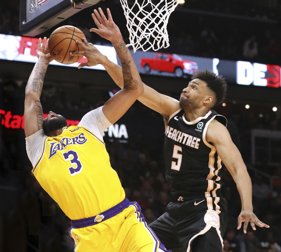 Atlanta Hawks forward Jabari Parker (5) blocks a shot by Los Angeles Lakers forward Anthony Davis (3) during the second half of an NBA basketball game Sunday, Dec. 15, 2019, in Atlanta. The block was called a foul but was overturned on a coach's challenge. Curtis Compton/ccompton@ajc.com/Atlanta Journal-Constitution via AP)