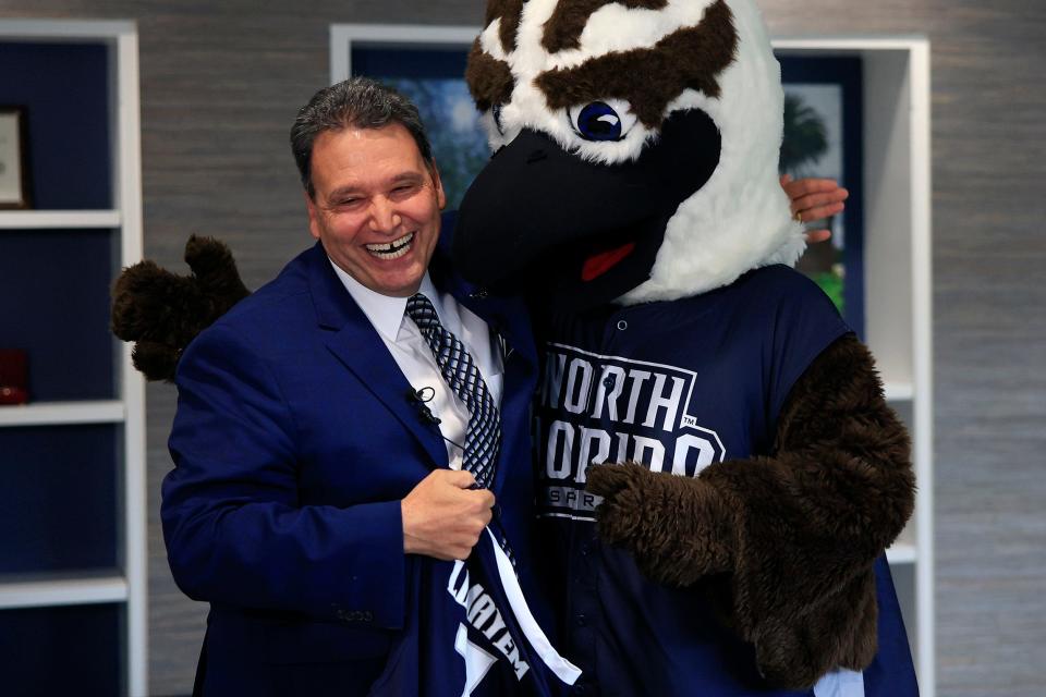 New President Moez Limayem is surprised with a jersey from Ozzie the Osprey as he speaks to media members at the UNF President's Office Monday, Aug. 1, 2022 in Jacksonville. The media meet and greet was to ask questions and understand Limayem's vision for the future. The number 7 was selected because he is the seventh president of the school. 