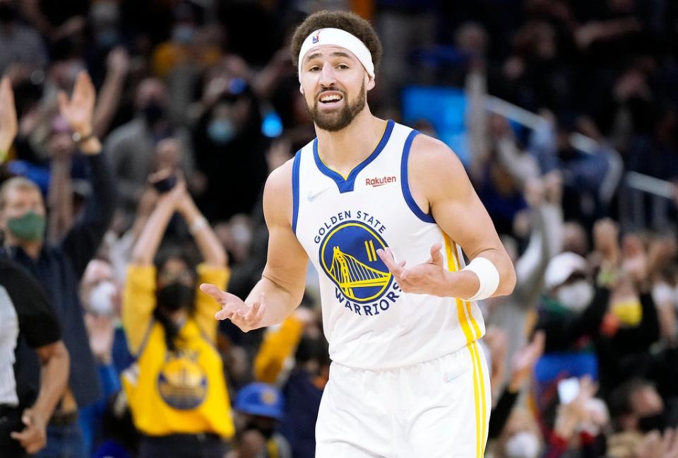 Klay Thompson reacts after scoring on a three-point shot against the Cavaliers (Getty)