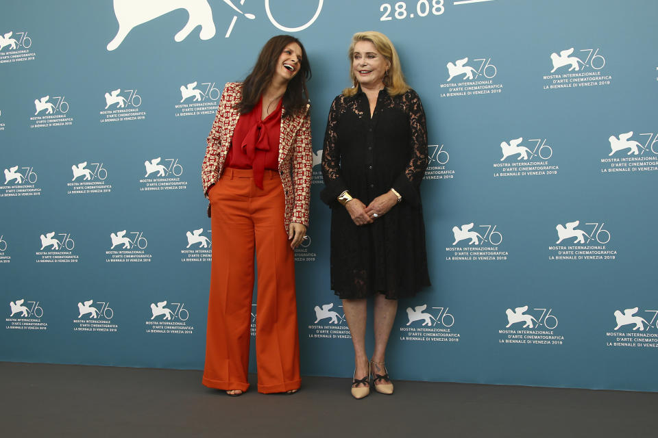 Actresses Juliette Binoche, left, and Catherine Deneuve pose for photographers at the photo call for the film 'The Truth' at the 76th edition of the Venice Film Festival in Venice, Italy, Wednesday, Aug. 28, 2019. (Photo by Joel C Ryan/Invision/AP)