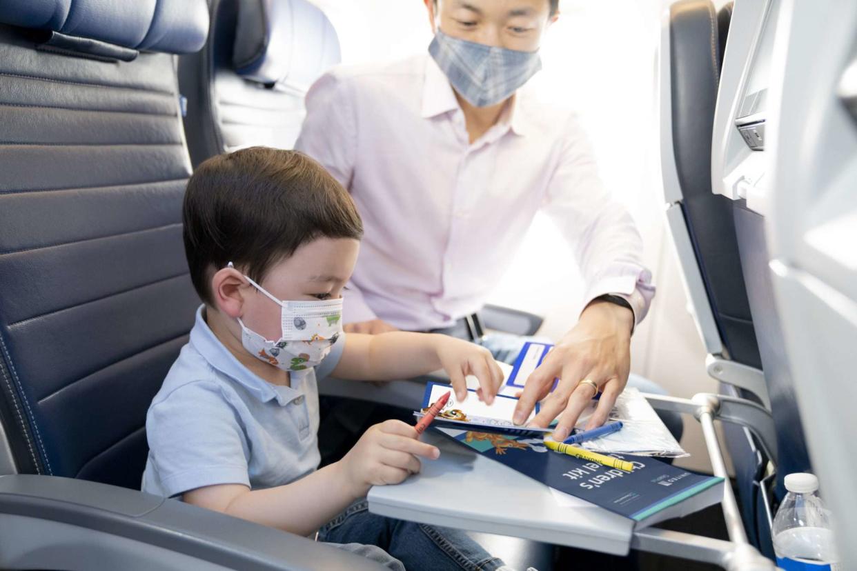 Little boy on United Airlines flight with activities