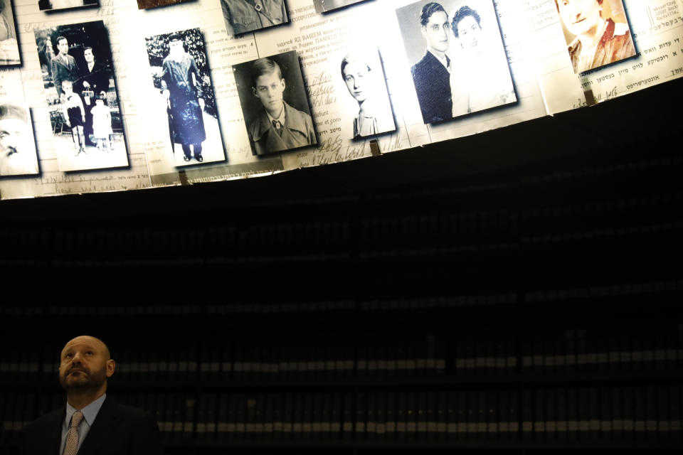 Lebanese-born Swiss real estate mogul Abdallah Chatila, who purchased Nazi memorabilia at a German auction and is donating the items to Israel, visits at the Hall of Names in Yad Vashem in Jerusalem, Sunday, Dec. 8, 2019. Chatila, a Lebanese Christian who has lived in Switzerland for decades, paid some 600,000 euros ($660,000) for the items at the Munich auction last month, intending to destroy them after reading of Jewish groups' objections to the sale. Shortly before the auction, however, he decided it would be better to donate them to a Jewish organization. (AP Photo/Ariel Schalit)