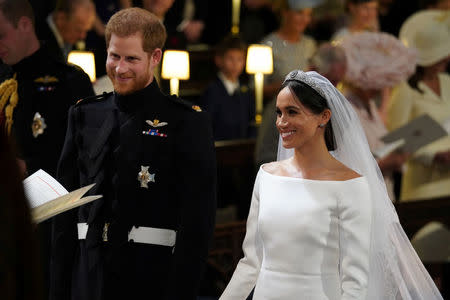 Prince Harry and Meghan Markle in St George's Chapel at Windsor Castle during their wedding service Windsor, Britain May 19, 2018. Jonathan Brady/Pool via REUTERS