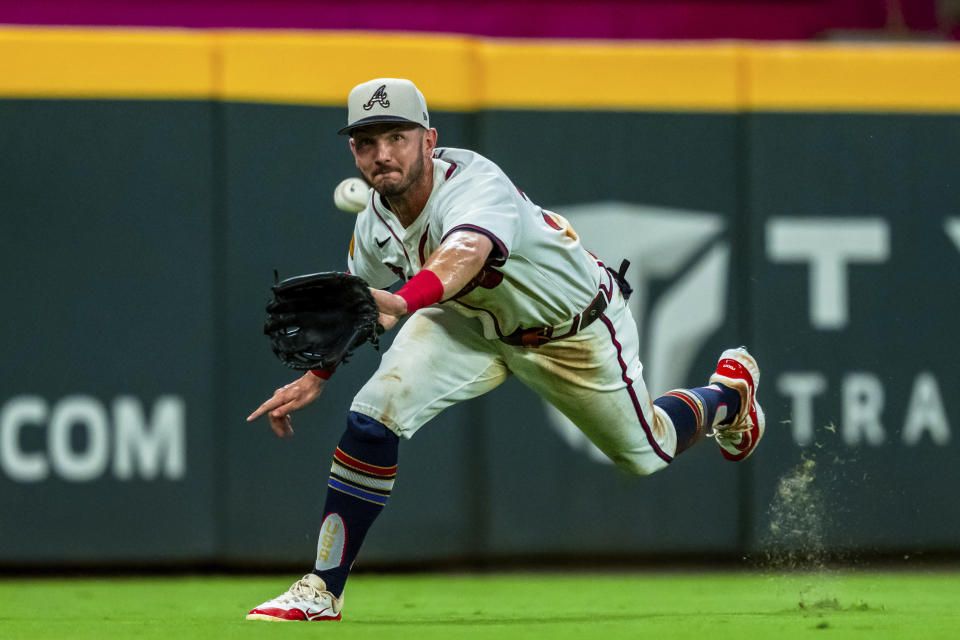 Atlanta Braves left fielder Forrest Wall (37) stretches out for a pop fly during the eighth inning of a baseball game against the San Fransisco Giants, Thursday, July 4, 2024, in Atlanta. (AP Photo/Jason Allen)
