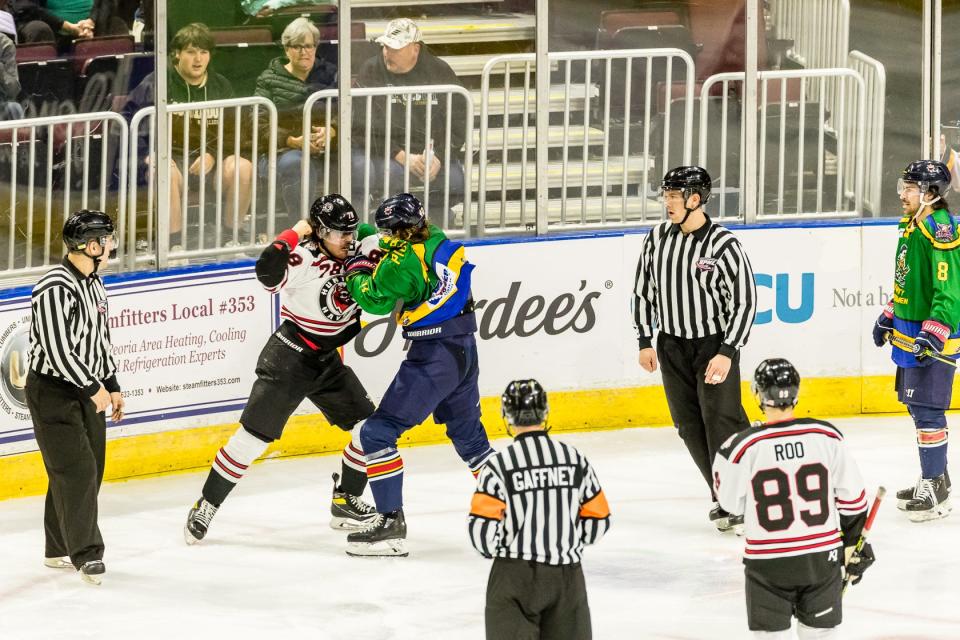 Rivermen winger JM Piotrowski fights SPHL penalty minutes leader Cole Reginato during a 5-3 win over Huntsville at Carver Arena on Saturday, Dec. 10, 2022.