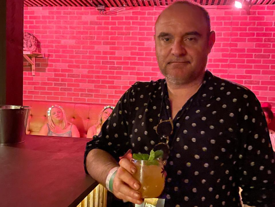 lynn's brother with cocktail in Speakeasy